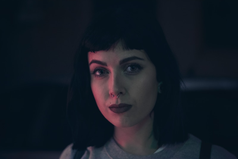 night, looking at camera, close-up, contemplation, front view, headshot, portrait, nose ring, young women, photography, women, face, dark, one person, beautiful woman
