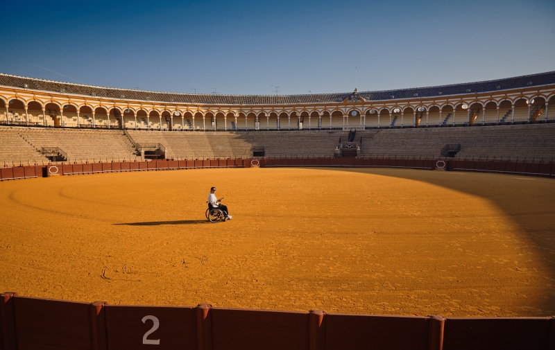 bull ring, bullring, architecture, middle, wheelchair, stadium, 2K, tourism, clear sky, person, travel destinations, outdoor, city, men, sitting, travel