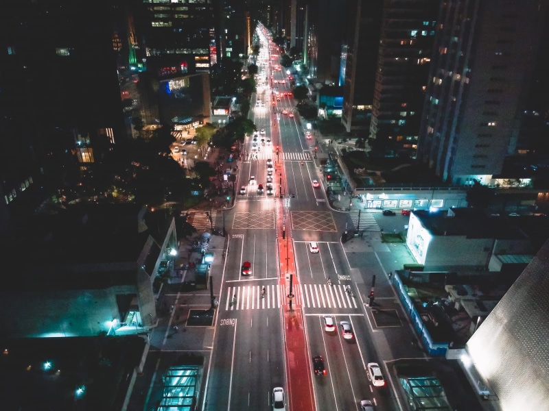 spark, office building exterior, road, skyscraper, mode of transportation, city street, drone, traffic, land vehicle, high angle view, built structure