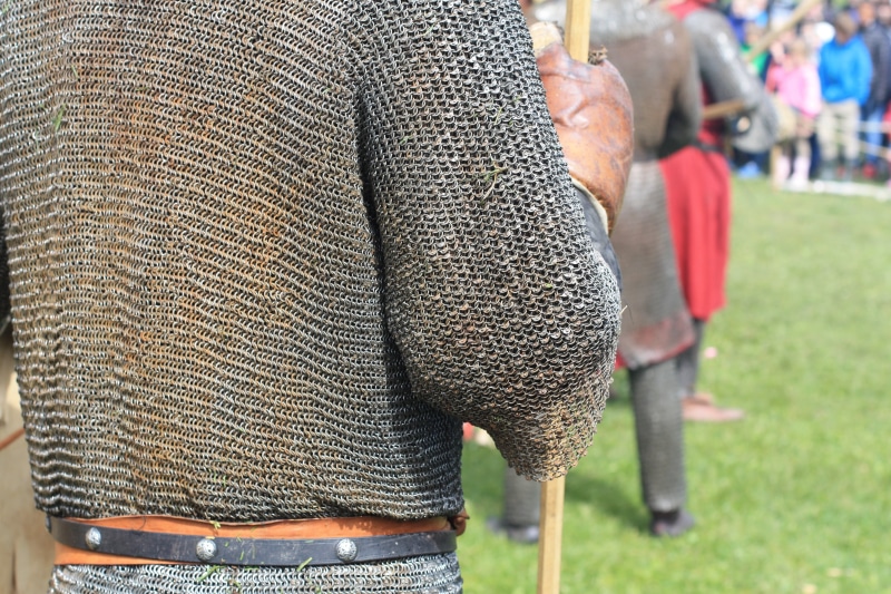 strength, one person, warrior, fighter, close-up, 4K, armor, chivalry, protection, fashion, incidental people, weapon, sword, human limb, focus on foreground