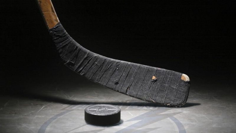 close-up, flooring, black, shoe, ice rink, puck, broken, stick, container, dirty, single object, equipment, studio shot, no people, metal, Hockey, black background