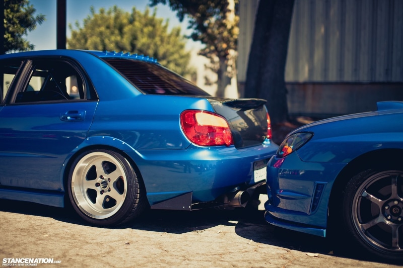 car accident, focus on foreground, transportation, blue, broken, land vehicle, mode of transportation, road, demolished, stationary, motor vehicle, built structure