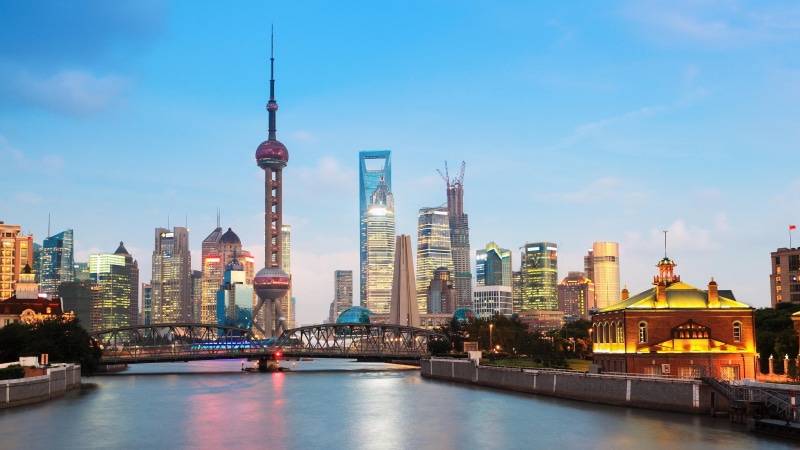 building, boat, skyscraper, sunset, built structure, spire, urban, harbor, travel destinations, city, dock, town, night, tourism, river, ship, bay, boats