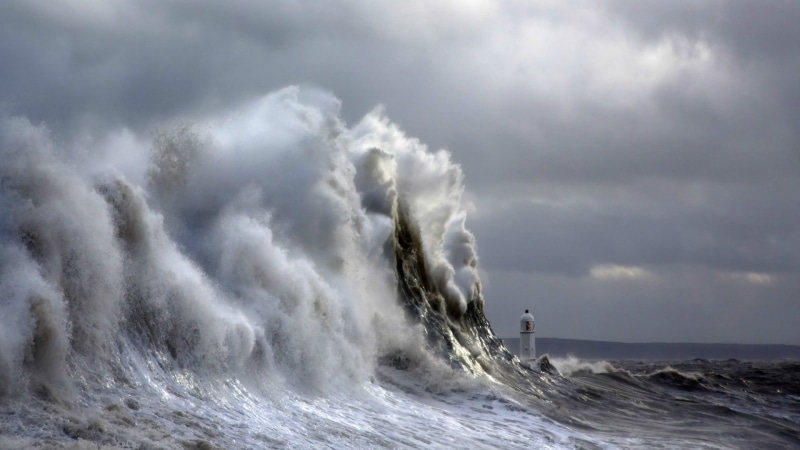 breaking, water, outdoors, power in nature, motion, scenics - nature, hills, ominous, risk, people, lighthouse, sky, waves, sign, surfing, power, sea, conquering adversity