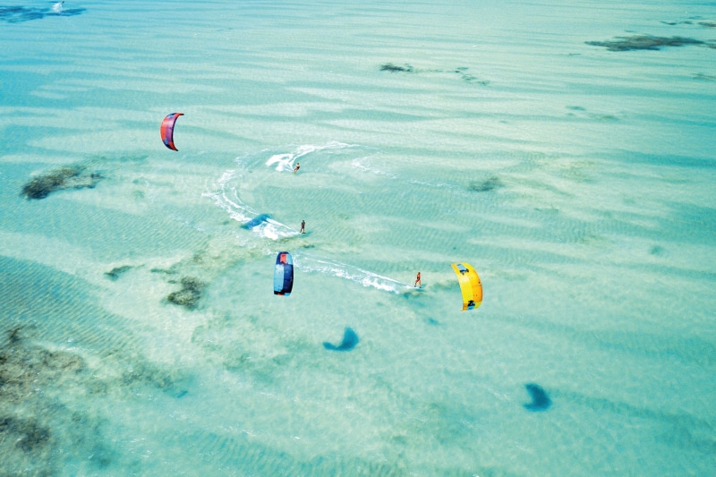 extreme sports, turquoise colored, outdoors, people, land, sea, 2K, high angle view, beauty in nature, vacations, summer, zanzibar, unrecognizable person