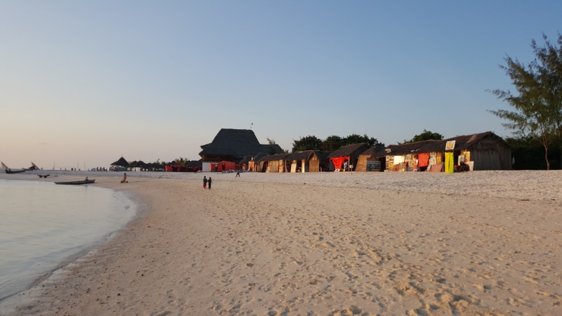 incidental people, outdoors, zanzibar, built structure, hut, beach, blue, sea, building exterior, tanzania, scenics - nature, sky, 5K, africa, day, clear sky
