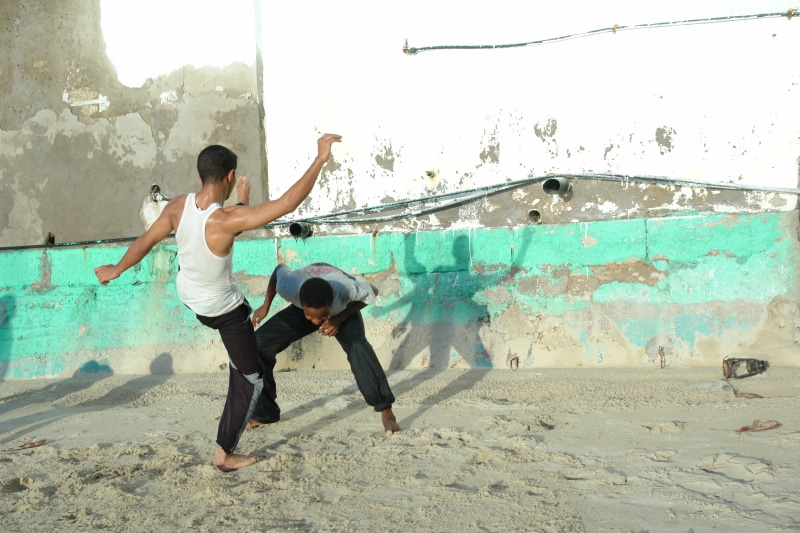 human arm, leisure activity, casual clothing, young adult, outdoors, capoeira, lifestyles, young women, tanzania, dance, side view, 4K, fun, full length