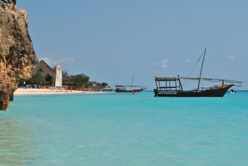 land, nautical vessel, blue, zanzibar, black, day, wooden, nature, africa, no people, tranquility, outdoors, sky, tranquil scene, sunlight, boats, scenics - nature