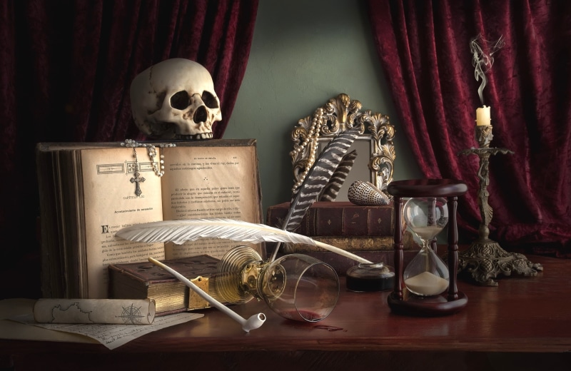 mirror, arts culture and entertainment, tube, feather, no people, cross, group of objects, male likeness, tobacco, white, curtains, skeleton, furniture