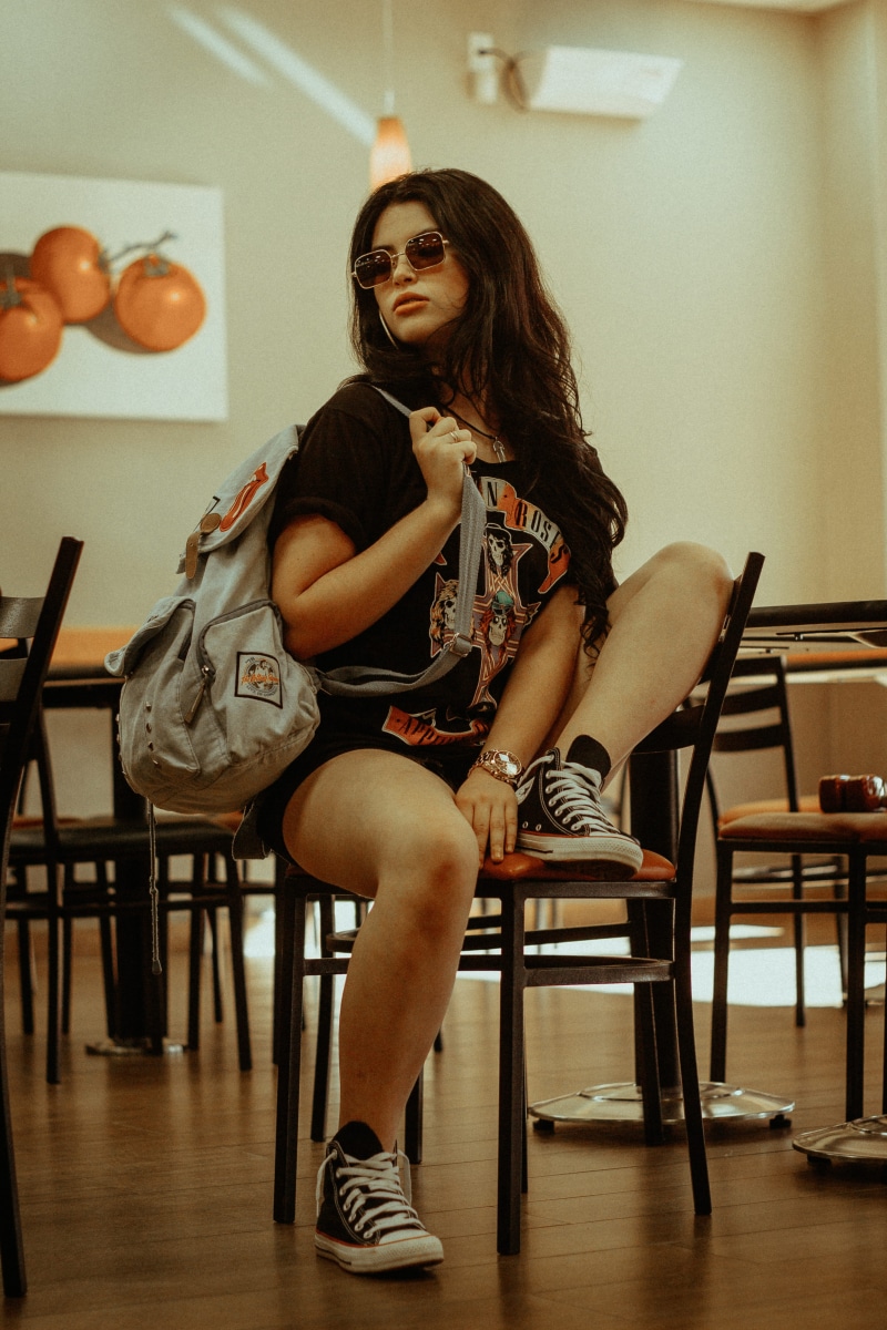 orange, indoor, hairstyle, style, long hair, chair, portrait, real people, young women, brown, one person, tshirt, black, seat, indoors, sunglasses, red