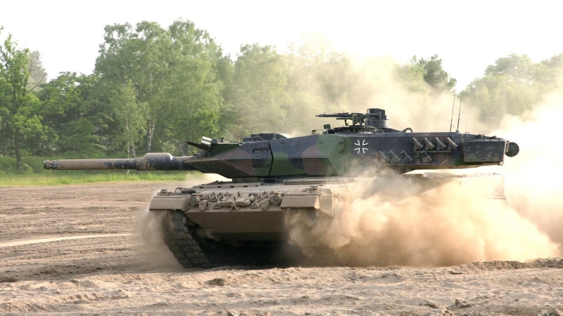 no people, outdoors, weapon, Leopard 2, mode of transportation, aggression, armed forces, transportation, nature, army, plant, armored tank, motion, day