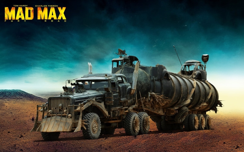 no People, communication, outdoors, mad, truck, the war rig, land Vehicle, desert, commercial land vehicle, sign, old, cloud - sky, transportation, movie
