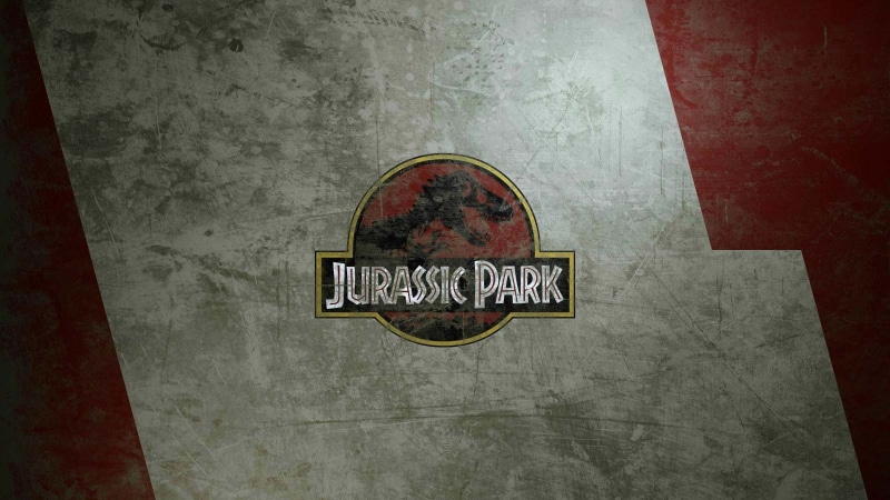 logo, movies, wall - building feature, indoors, close-up, high angle view, flooring, information, Jurassic Park, communication, western script, paper, sign