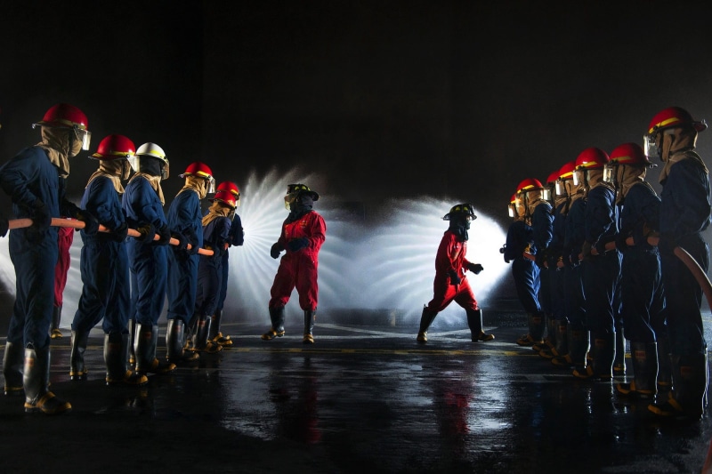 service, spray, sport, blue, in a row, danger, outdoors, illuminated, rear view, equipment, performance, job, motion, practice, two, night, lines, firefighters