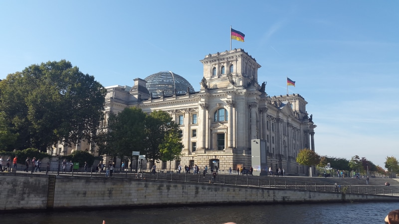 bundestag, sky, built structure, flag, city, government buildings, history, architecture, glass dome, berlin government, plant, outdoors, building exterior