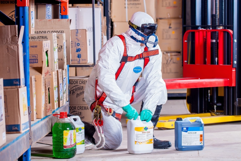 headwear, chemist, lift, protective workwear, full length, industry, real people, men, work clothes, occupation, costume, adult, equipment, bottle, holding