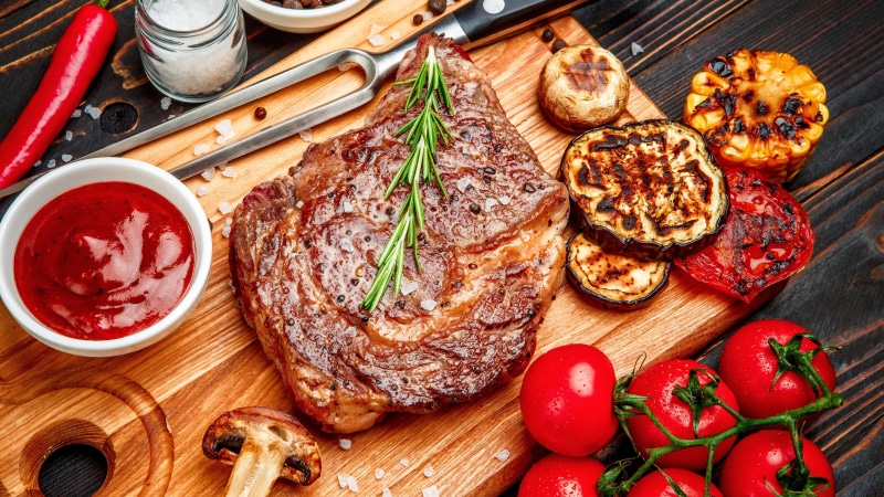 lunch, animal source foods, grillades, rib eye steak, wood - material, fruit, meal, table, meat, cooked, beef, tomato, healthy eating, steak, vegetable