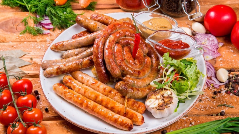 table, cuisine, indoors, animal source foods, still life, meat, german cuisine, serving size, cherry tomato, german food, grill, dish, fruit, sausage, grilled