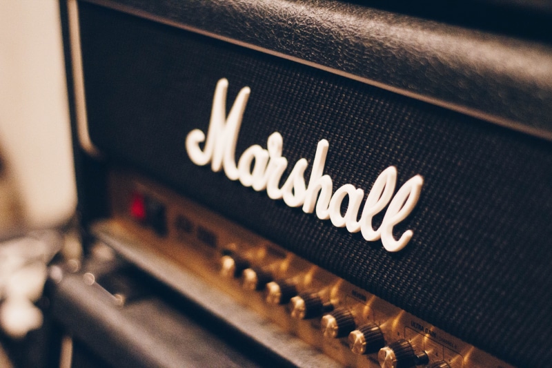 arts culture and entertainment, close-up, capital letter, single object, focus on foreground, music, marshall, black, western script, amplifier, 5K, text