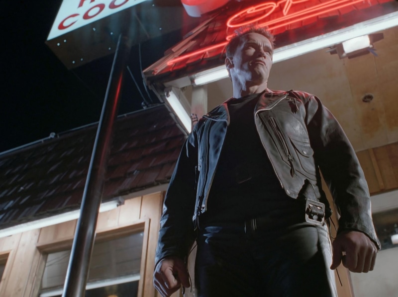 Terminator 2, jacket, standing, lifestyles, hairstyle, low angle view, 720P, T-800, waist up, leisure activity, Remaster, Terminator, leather jacket, architecture