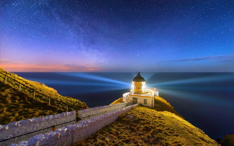 building exterior, architecture, galaxy, tower, sea, astronomy, 1080P, coast, long exposure, beauty in nature, star - space, building, astrology, starry night