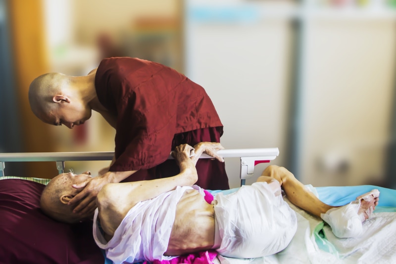 caring, furniture, full length, 4K, console, unhealthy, side view, sick, illness, man, sitting, young adult, face, monk blessing patient, women, people