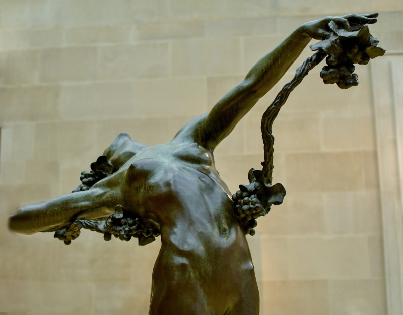 wall - building feature, statue, human representation, history, male likeness, sculpture, agony, craft, mammal, day, built structure, art, symbol, monument