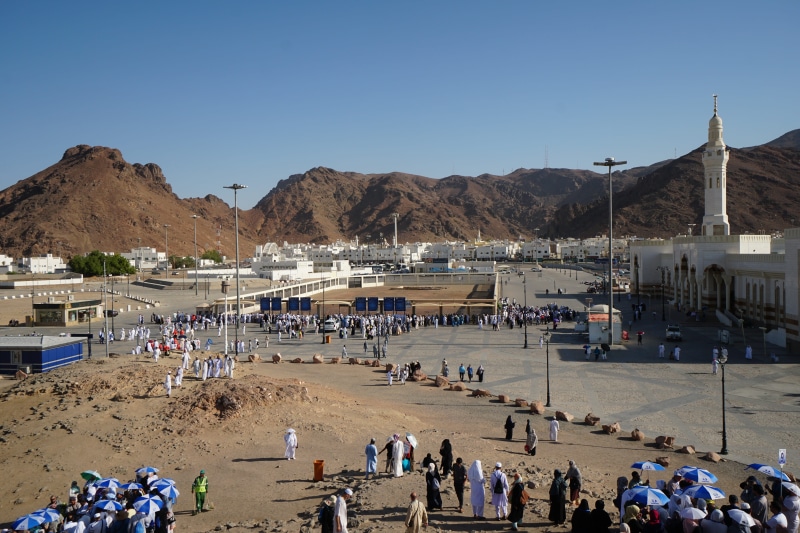 the martyrs of uhud, crowd, land, the mountain of uhud, leisure activity, water, group of people, women, men, day, beach, clear sky, sky, nature, mountain