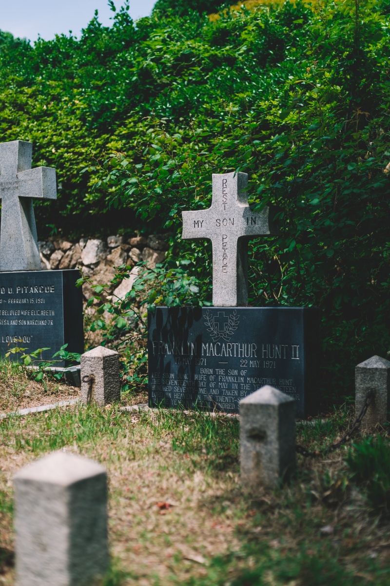 text, solid, catholic, no people, stone material, south korea, sadness, rest in peace, stone, cross, outdoors, graveyard, spirituality, religion, tombstone
