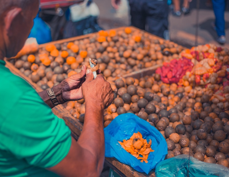 one person, market stall, holding, adolpho lisboa municipal market, abundance, freshness, food and drink, men, manaus, hand, southamerica, brasil, amazonas