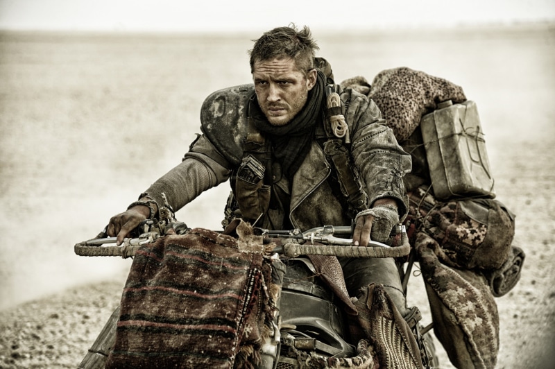 one person, real people, military, Road rage, Tom Hardy, holding, looking at camera, s, day, postapocalyptic, focus on foreground, clothing, Fury Road