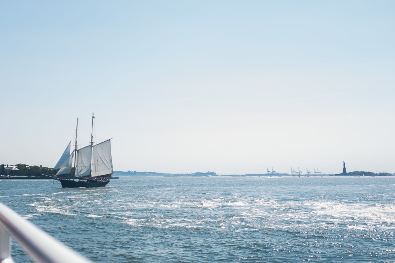 luxury, mode of transportation, daytime, river, pole, ferry, sailship, pirate, hudson river, water, beauty in nature, vessel, sun, governor island, ship