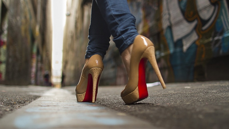 fashion, blurred, leather, street, Louboutin, one person, surface level, selective focus, shoe, human leg, high heels, human body part, outdoors, low section