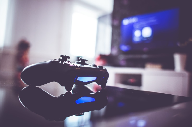 playstation, focus on foreground, holding, illuminated, no people, day, wireless technology, play, gaming, 4K, playing, screen, movie, human hand, photography themes