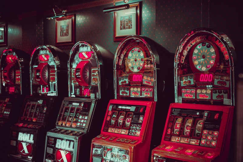arts culture and entertainment, pink, indoors, slot, large group of objects, casino, close-up, wall, gambling, choice, machines, brown, for sale, multi colored