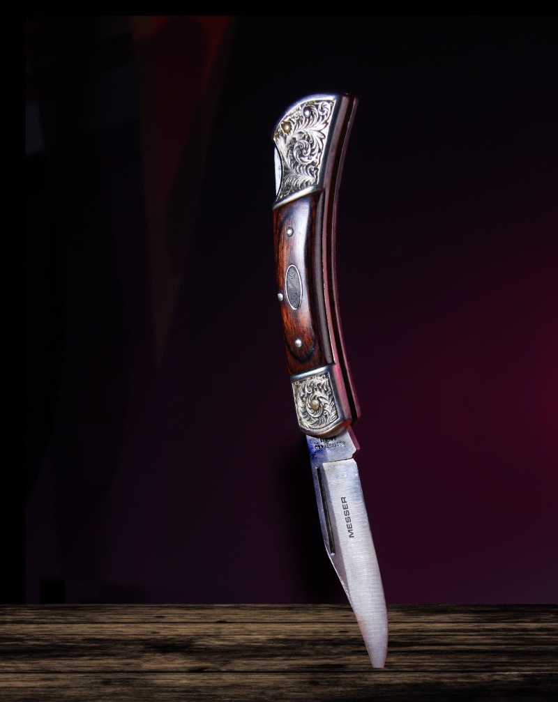 close-up, the past, studio shot, no people, weapon, antique, expensive, blade, craft, still life, table, lock blade, wood, man, metal, indoors, light, art and craft