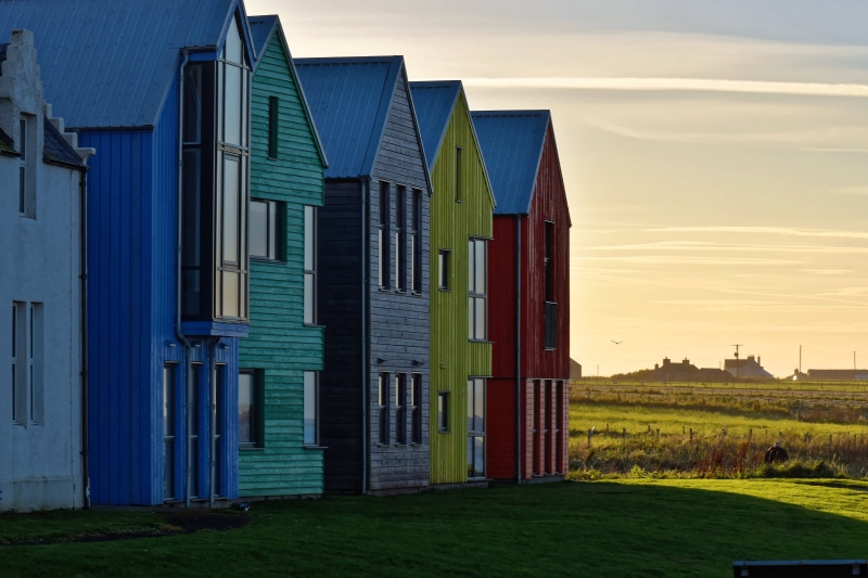 style, property, built structure, red house, nature, paint, design, outdoors, green, red, architecture, land, home, sunset, roof, yellow house, farm, barn