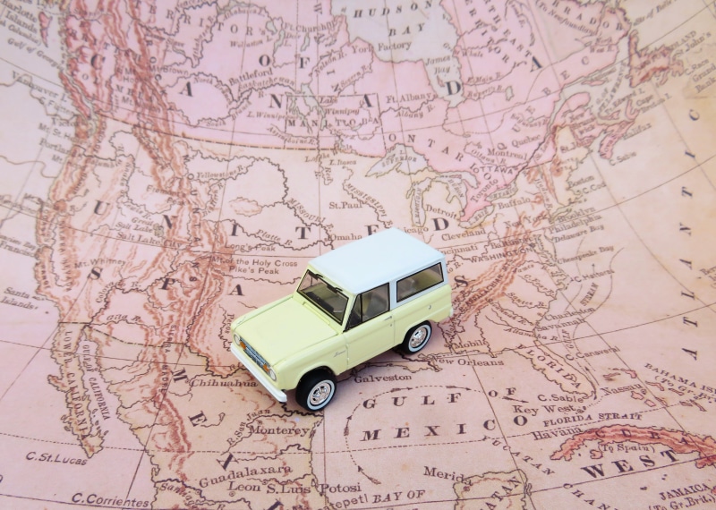 driving, transportation, route, still life, high angle view, land vehicle, toy, no people, indoors, map, cartography, direction, road trip, beige, suv