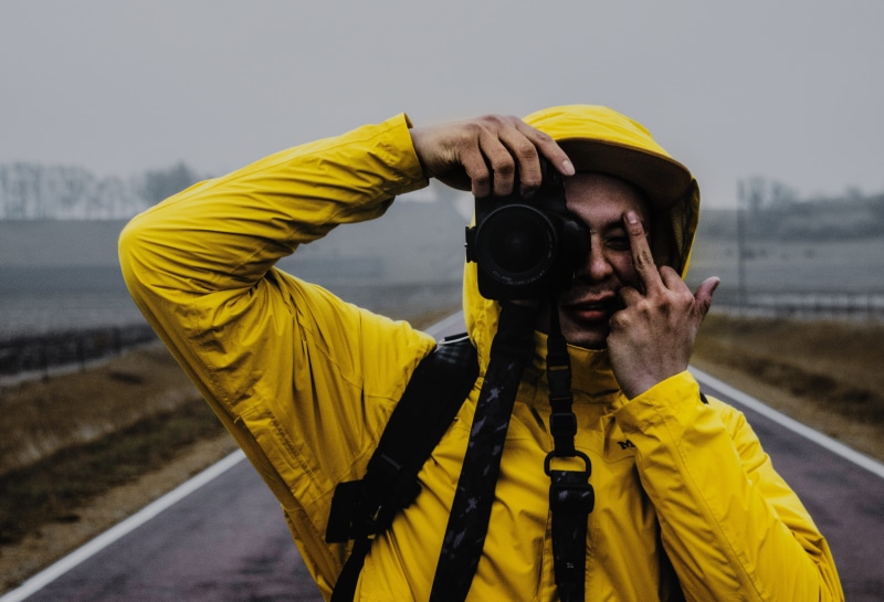 obscured face, hat, person, clothing, road, caucasian Ethnicity, middle, real people, jacket, man, black, outdoors, nature, holding, watching, young adult