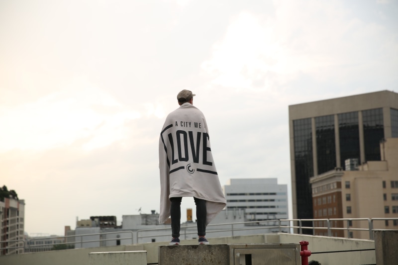 human representation, outdoors, rooftops, urban, politics, white, lifestyle, male likeness, building, low angle view, person, nature, full length, one person