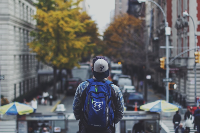 architecture, backwards, day, road, roads, real people, guy, selective, urban, building exterior, built structure, backpack, one person, men, safety, protection
