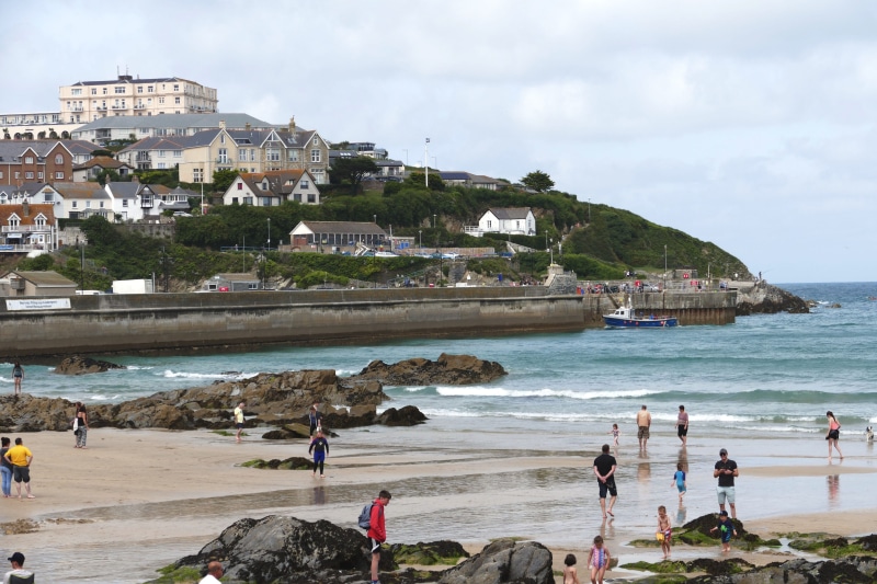 north, nature, shore, sea, seascape, building exterior, travel destinations, waves, sun, south, sand, crowd, rock - object, holiday, bay, Beach, tide, english