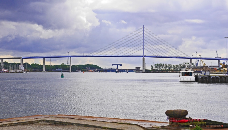 sky, brick bridge, built structure, river, bay, outdoors, baltic sea, bridge, drawbridge, bridge - man made structure, cloud - sky, connection, hanseatic city