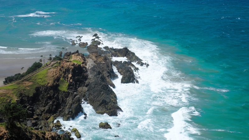 rock formation, sport, water, rocky coastline, sea, land, rock, breaking, australia, byron bay, solid, high angle view, aquatic sport, no people, outdoors
