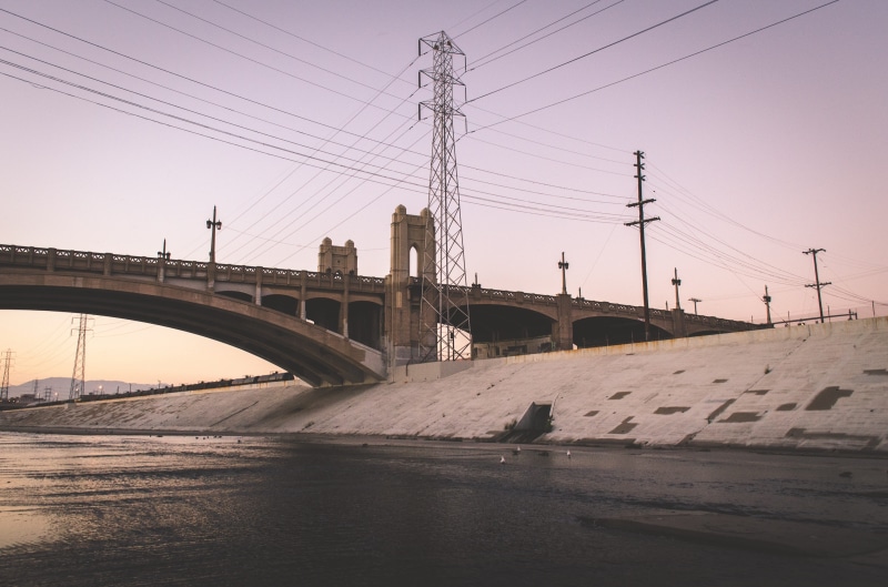 arch bridge, crossing, electricity pylon, building, electric, connection, power line, built structure, concrete, bridge, no people, construction, day, power supply