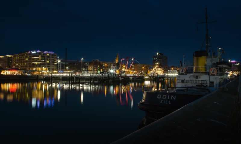 coast, mode of transportation, pier, moored, nature, port of kiel, night, waterfront, shipping, tug, water, building exterior, nautical vessel, sailboat