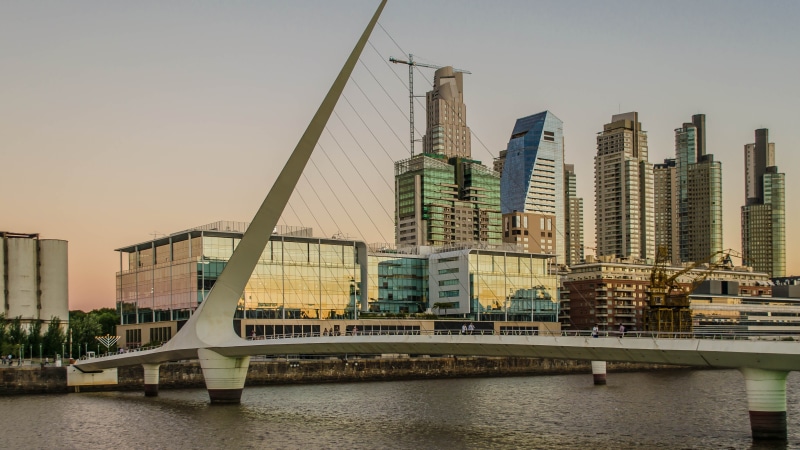 bridge - man made structure, skyscraper, sky, outdoors, building, financial district, water, building exterior, bridge, travel destinations, buenos aires