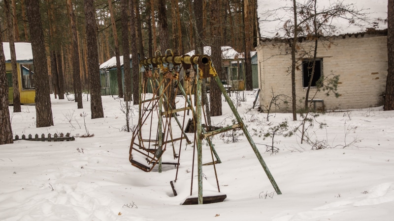 built structure, plant, exclusion zone, outdoors, ghost town, cold temperature, building exterior, pripyat, tree trunk, swing, decay, field, snow, camp
