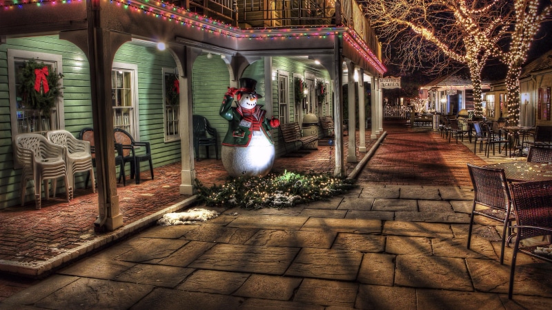 city, shadow, light, built structure, snowman, evening, paving stone, street, decoration, outdoors, architecture, glass - material, entrance, lighting