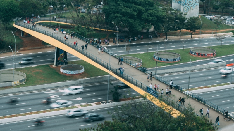 symbol, mode of transportation, highway, speed, people, trees, built structure, bridge, fast, expressway, architecture, marking, street, car, outdoors